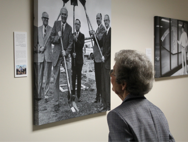 Third TCC employee Dot Binger looks on at a photo in the Archive Gallery Exhibit