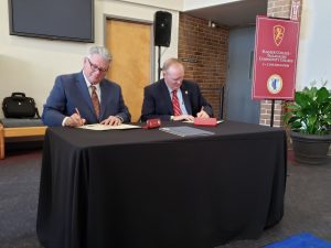 TCC President Jim Murdaugh and Flagler College President Joyner sign an articulation agreement for Elementary Education