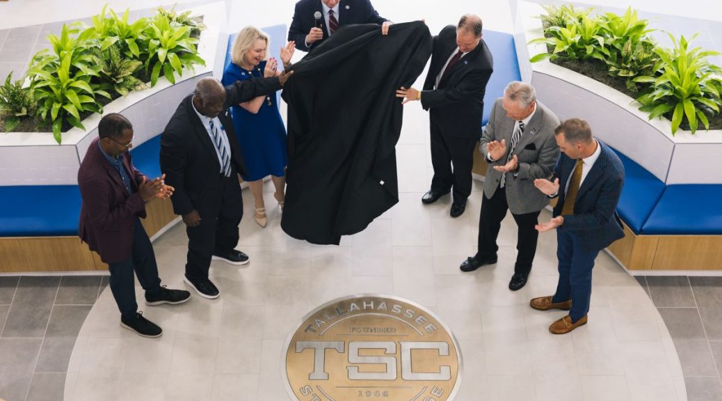 Tallahassee Community College President Jim Murdaugh and Trustees unveil the new Tallahassee State College academic seal